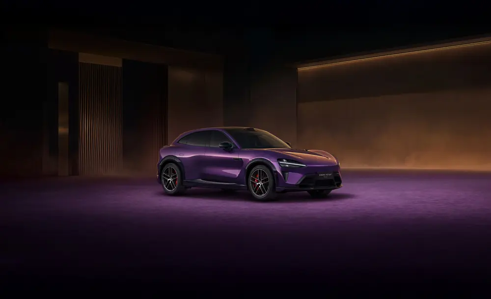 Xiaomi YU7 SUV in purple, photographed in a dark studio